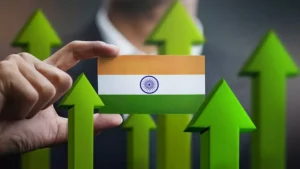 CRISIL Report highlights India's economic growth, depicted by a hand holding the Indian flag with green upward arrows in the background.